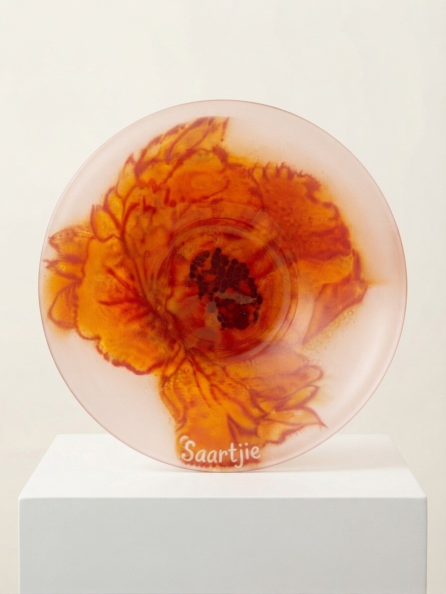 Amber Bloom Platter — a round fused-glass platter with an amber and rust floral bloom on a blush ground