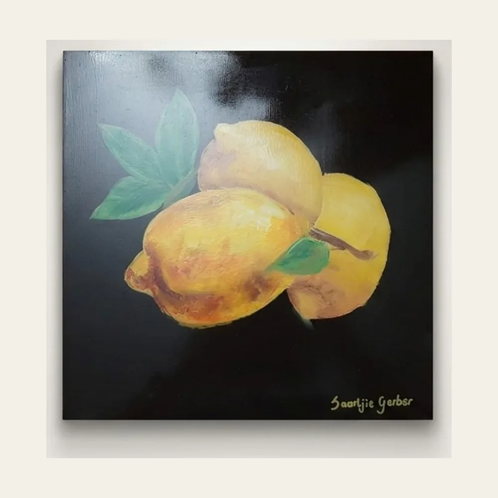 Lemons — three lemons with green leaves lit against a deep black ground.