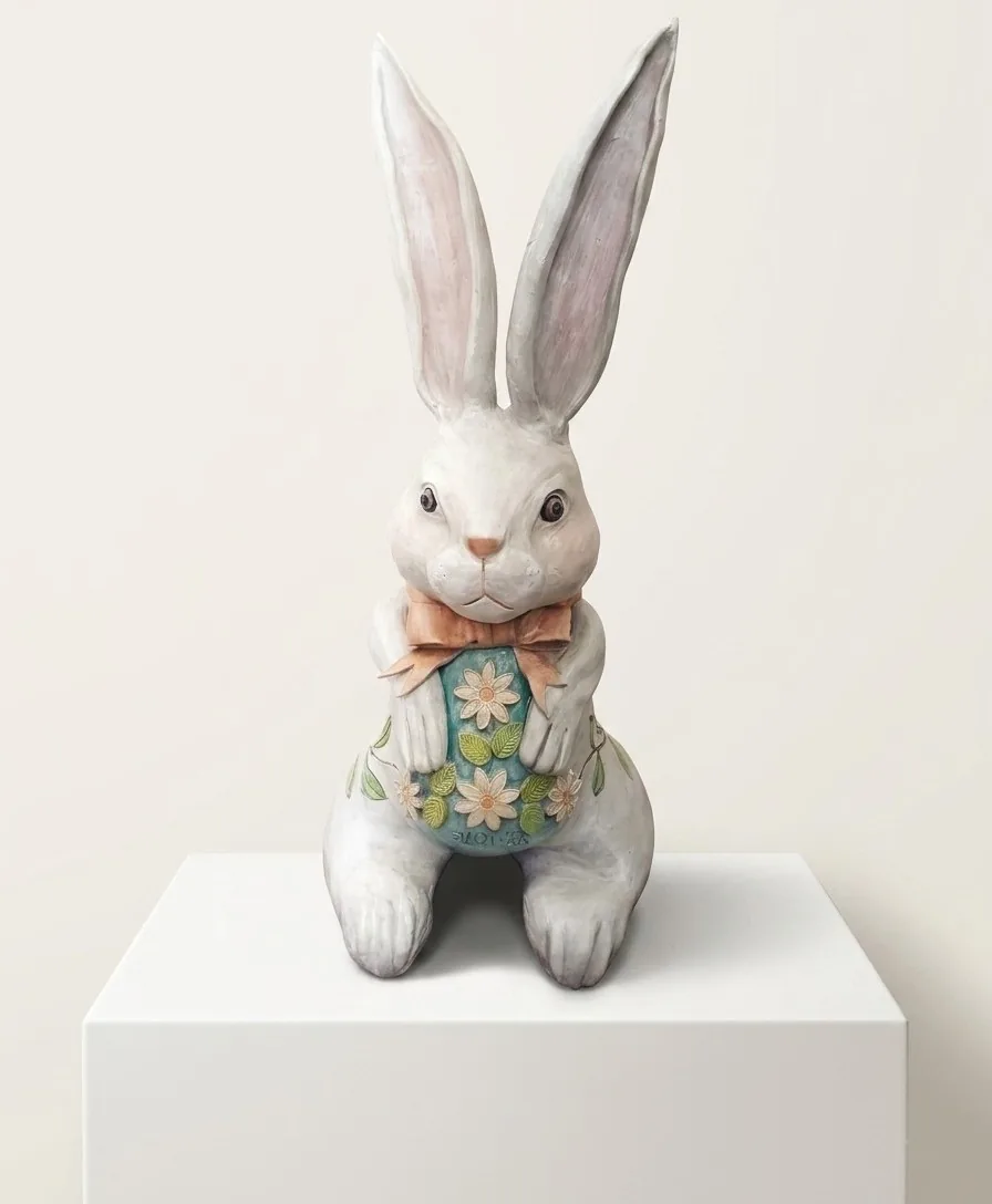 Hare in a Waistcoat — a tall white ceramic hare in a flowered waistcoat and bow tie